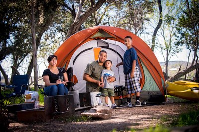 Camping.jpg Family posed in front of small tent